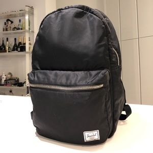 black backpack with silver zippers
